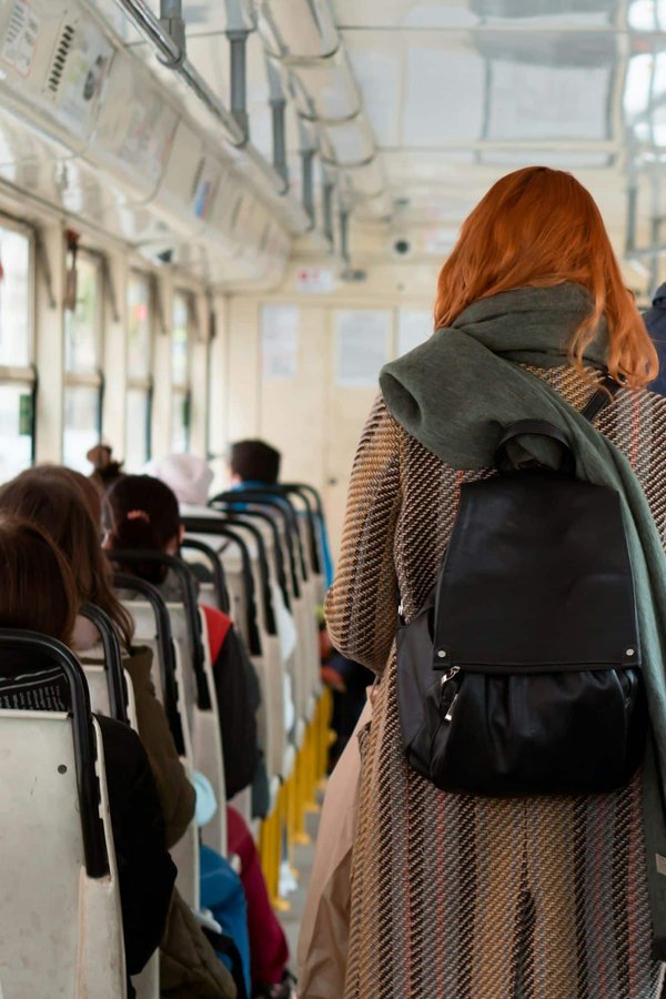 What is the safest way to transport large glass items in a station wagon?